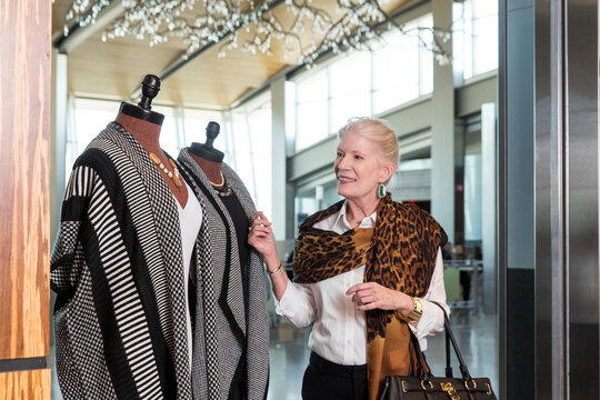 Attractive Senior Woman Shopping for Luxury Clothing