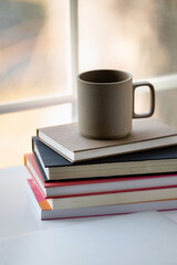 Mug of coffee and books