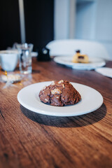 restaurant with served table with cup of coffee and delicious baked chocolate dessert, drink and food, lifestyle, delicious traditional pastries