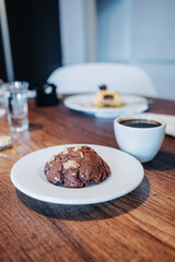 served table with cup of coffee and delicious chocolate cake, home made drink and food, lifestyle with dessert, delicious traditional pastries, texture detail
