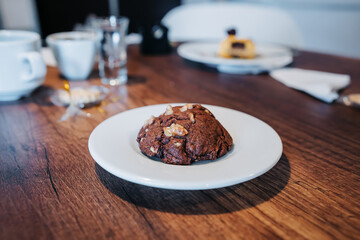 served table with cup of coffee and chocolate cake, drink and food, cafeteria lifestyle with dessert, delicious traditional pastries