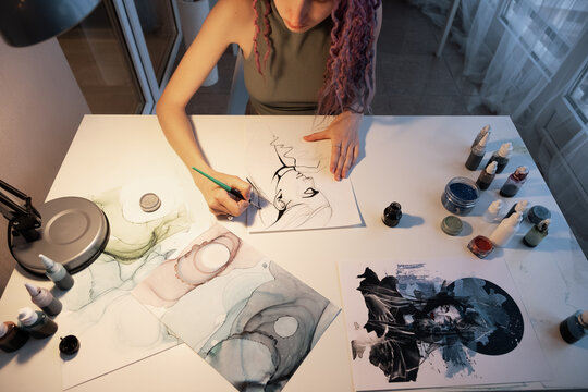 Crop woman drawing ink portrait