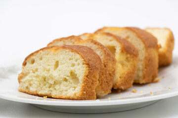 some slices of pound cake in a plate in white background