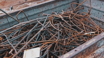Metal Scraps from Construction Site Rebar Rods Stored in Waste Container