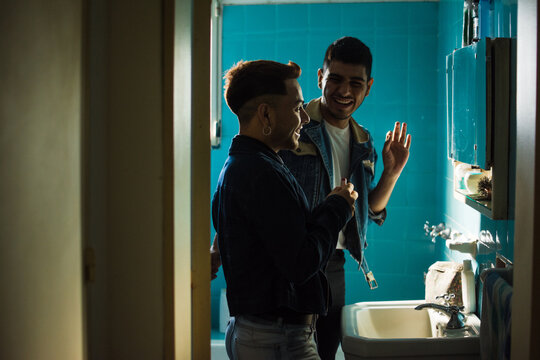 Happy gay couple at home