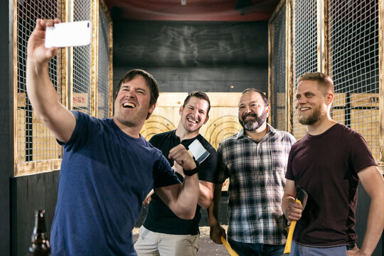 Axe Throwing Guys Get A Selfie Photo Together