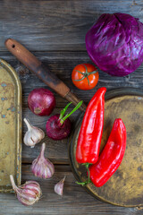 Top view, fresh vegetables, red tomato, pepper, cabbage, onion, on wooden background. Food concept....