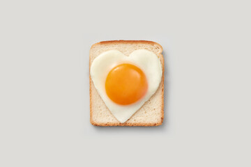 Tasty toast with egg in shape of heart