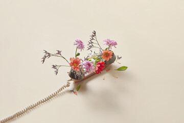 Retro telephone handset with spring flowers