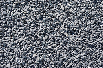 Gravel of black pebbles pattern background