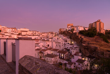 Fototapeta premium Panoramic view of the beautiful and famous white village of Setenil de las Bodegas from a viewpoint at sunrise, Cadiz province, Andalusia, Spain