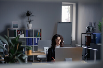 Professional broker using computer for analyzing data