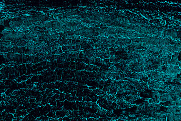 Rugged tree bark with blue overlay for texture background