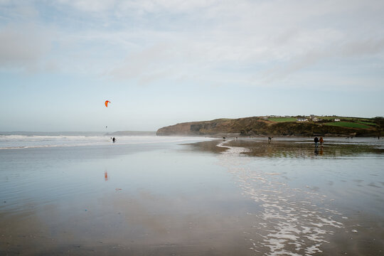 Winter walkers and kite surfers Wales