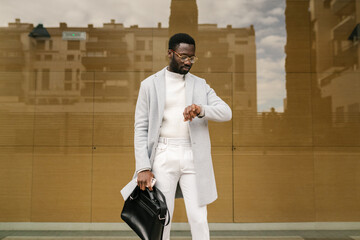 Black stylish watching time on wristwatch