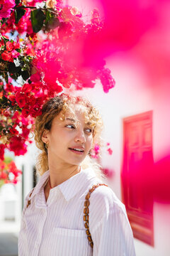 Pretty girl among flowers