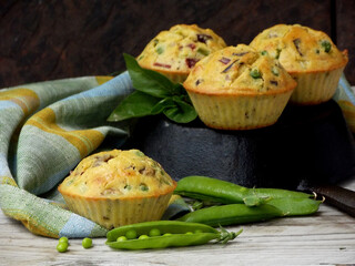 Freshly baked muffins with green peas and feta cheese. Healthy food concept. Savory pastry