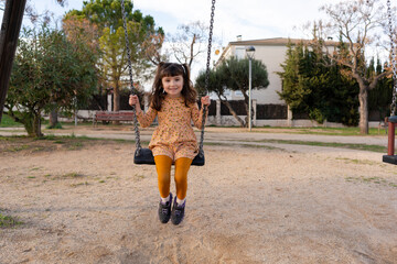 Girl on a swing at playground