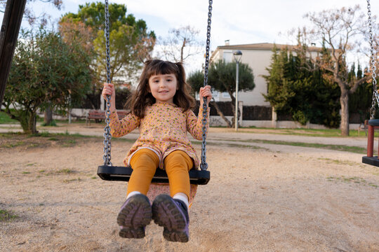 Girl on a swing at playground