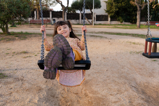 Girl on a swing at playground