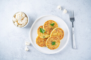 Cauliflower burgers with carrot and parsley