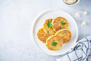 Cauliflower burgers with carrot and parsley