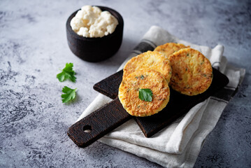 Cauliflower burgers with carrot and parsley