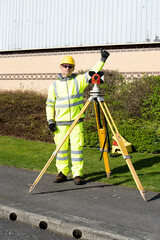Site engineer set prism above control point and giving ok sign