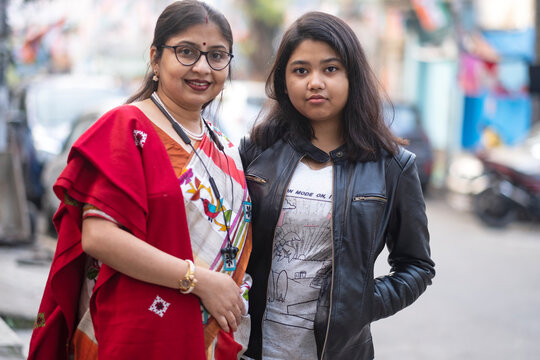 Mother And Daughter Together At Outdoors In Daytime