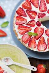 Cheesecake with fresh strawberry and mint