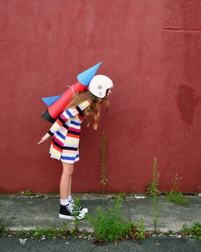 Child in Rocket Playing Outside
