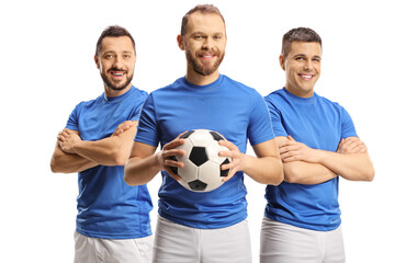 Team of football players smiling at camera