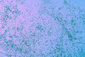 Abstract background of pink and blue confetti in neon light. A great background for design, manicure,invitation, birthday, wedding, Valentine's Day,