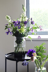 flowers in vase near the window