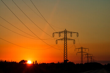 Electric power pylon, electric tower at sunset