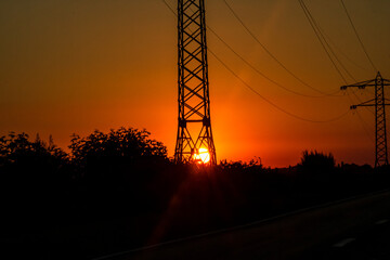 Electric power pylon, electric tower at sunset