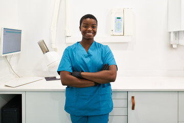 Smiling doctor in examination room