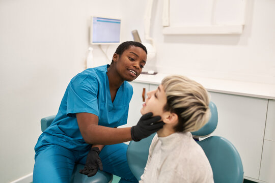 Young patient complaining to dentist