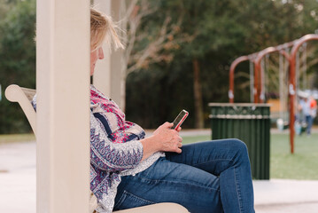 Trendy senior on mobile device