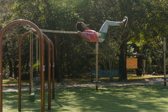 Black girl swinging