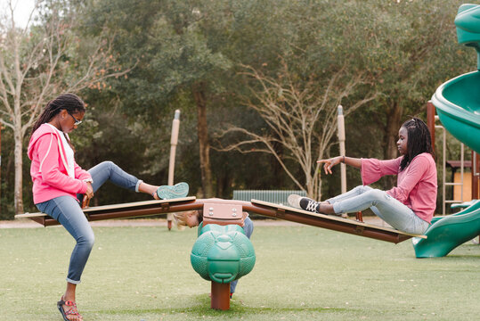 Black Girls On A Seesaw