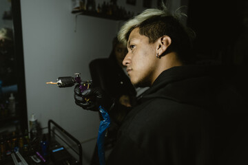 Professional Tattooer Aiming With His Tattoo Machine