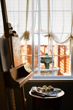Artist easel with a painting of still life apples