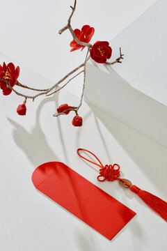 Tet Holiday (Chinese new year) Angpao pockets with red blossom branch border on red background