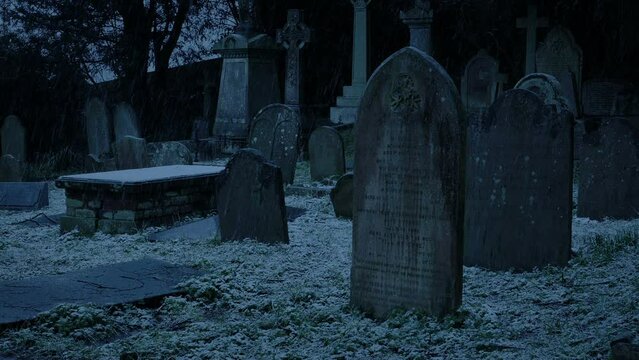 Graveyard In Snowfall On Winter Evening