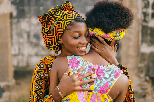African girls embracing in countryside
