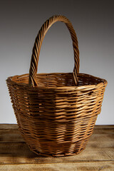 Obraz premium wicker basket on the board