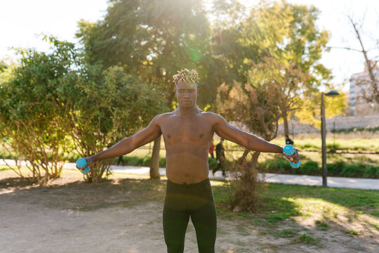 African shirtless guy during outside workout