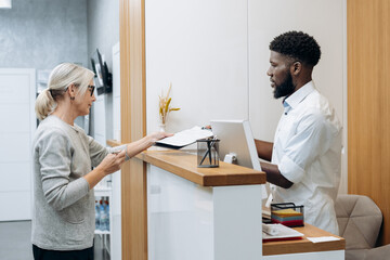 Mature white woman patient at dental clinic