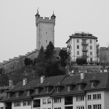 Monochrome image of the Musegg Wall and one of its towers.